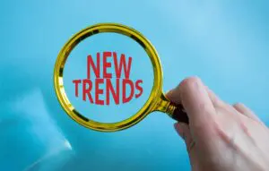 5 key tips for social media marketing 4 magnifying glass highlighting 'new trends'