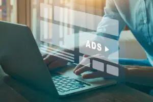 person on laptop looking at ads