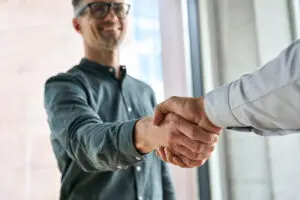two people shaking hands 