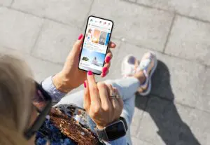 woman using social media on her phone