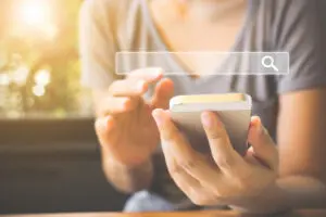 woman searching on mobile phone