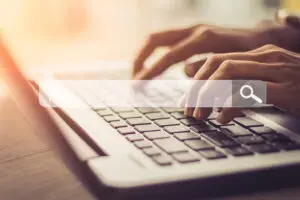 user searching on their laptop