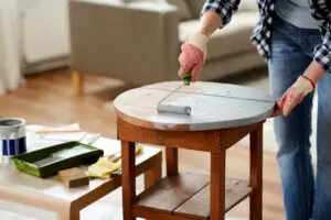 image of a person painting a table as part of home diy