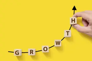 graphic showing growth on a scale