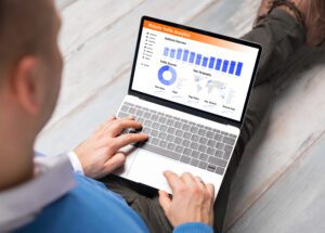 Man working on his computer viewing data on website traffic