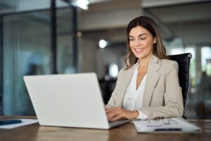 woman looking at her website smiling