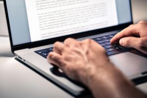 writing copy on a laptop