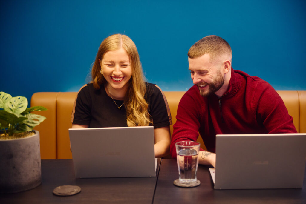 two embryo team members working in office