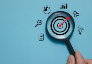 10 crucial targeting tips to boost your Facebook conversions 7 magnifying glass over targeting board with arrow in the middle, representing audience targeting