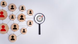 Network of audience with magnifying glass highlighting target audience