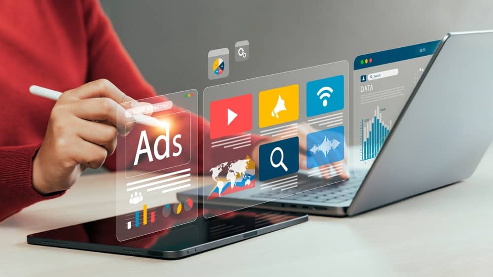 google ads user using laptop and in account data to navigate account suspension