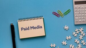 Paid media marketing notebook representing paid media blogs