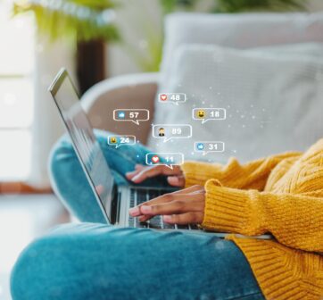women using social media on laptop