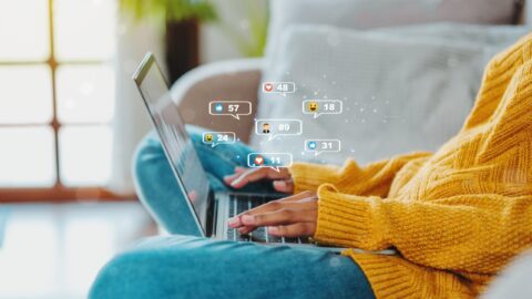 Women using social media on laptop