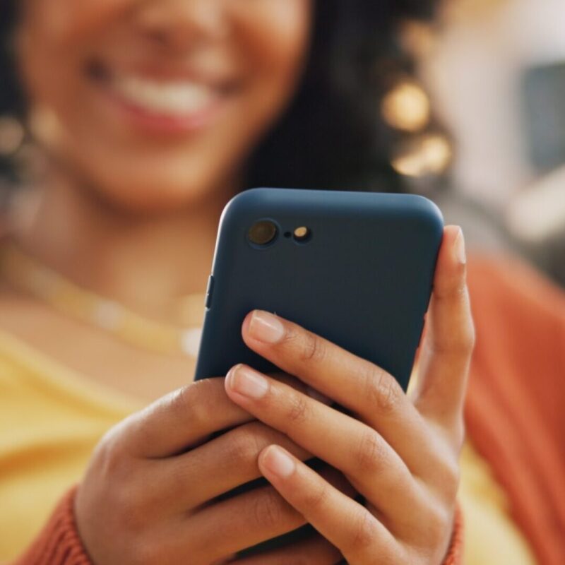 woman looking at social media on her phone