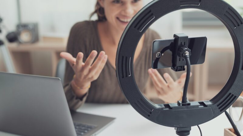 Woman filming a social media video for TikTok