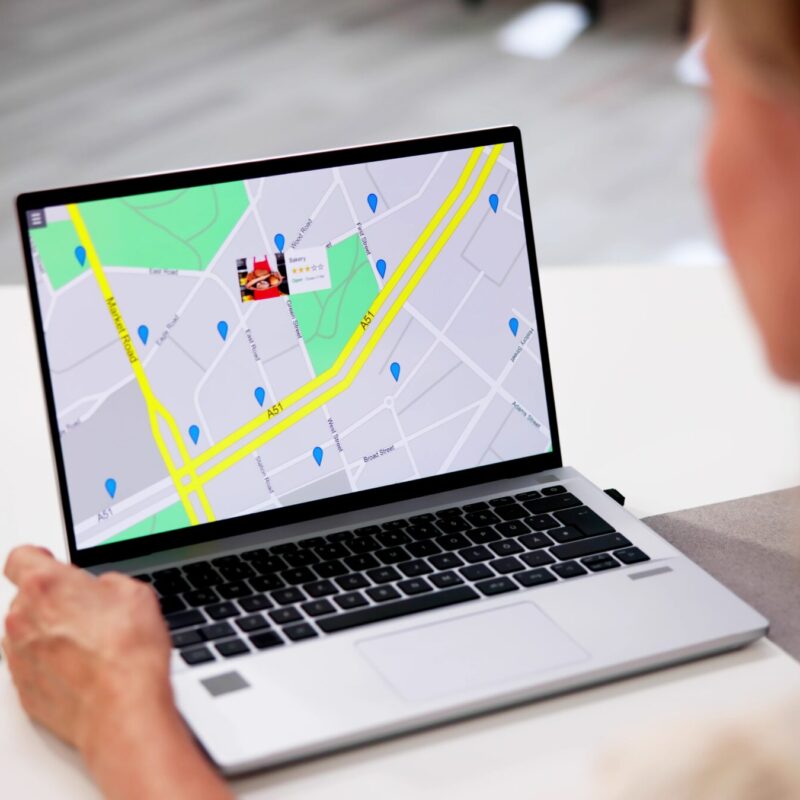 Local SEO 13 person using laptop with map display