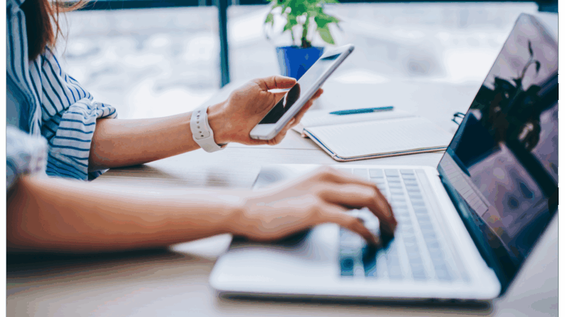 Organic social 2 woman using phone and laptop