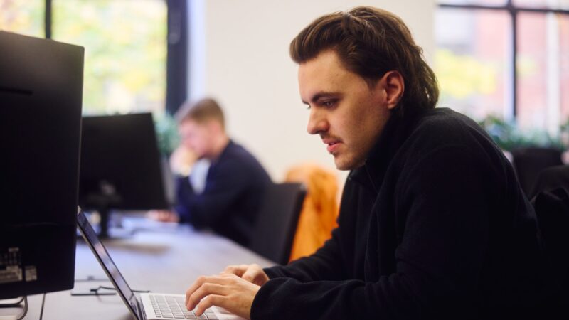 GEO/AEO 2 embryo team member working in office on video seo