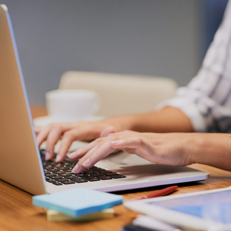 Clusterdome 5 woman writing informative content on a laptop