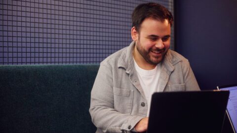 sam thomas from the embryo team working in office