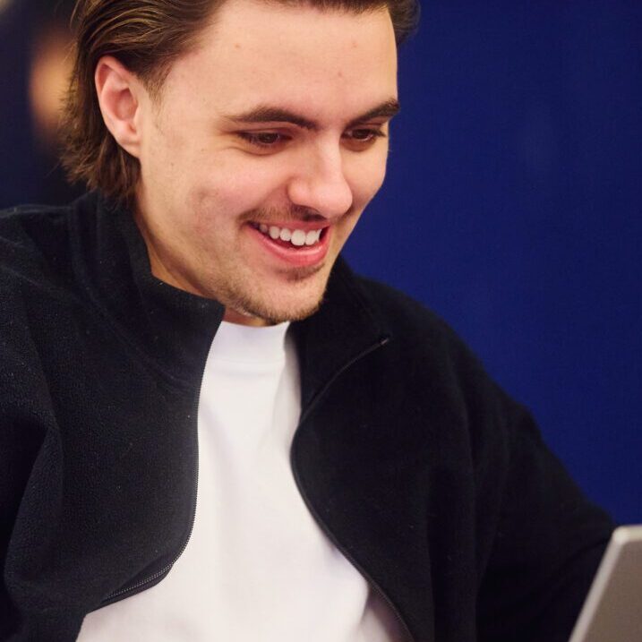 Luke from the Embryo Client services team working in the office