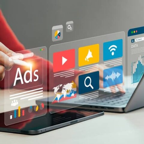 google ads user using laptop and in account data to navigate account suspension